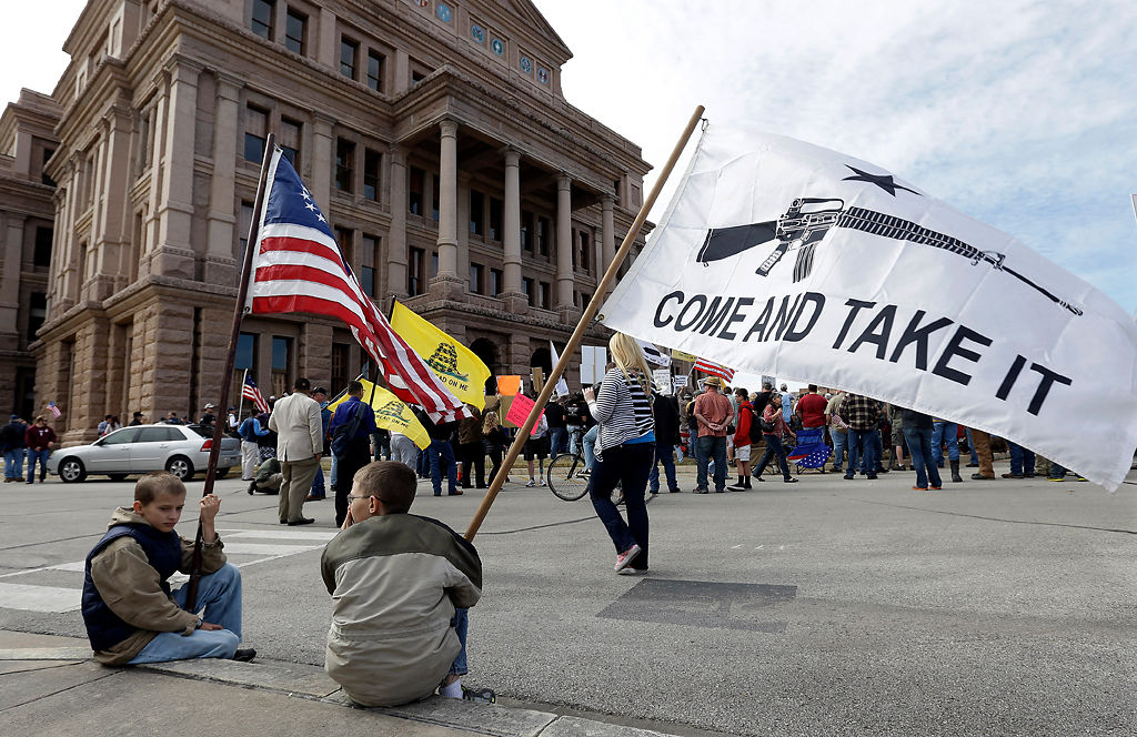 In this Jan. 19, 2013, file photo, gun rights supporters gather at a Guns Across America rally at the Texas state capitol